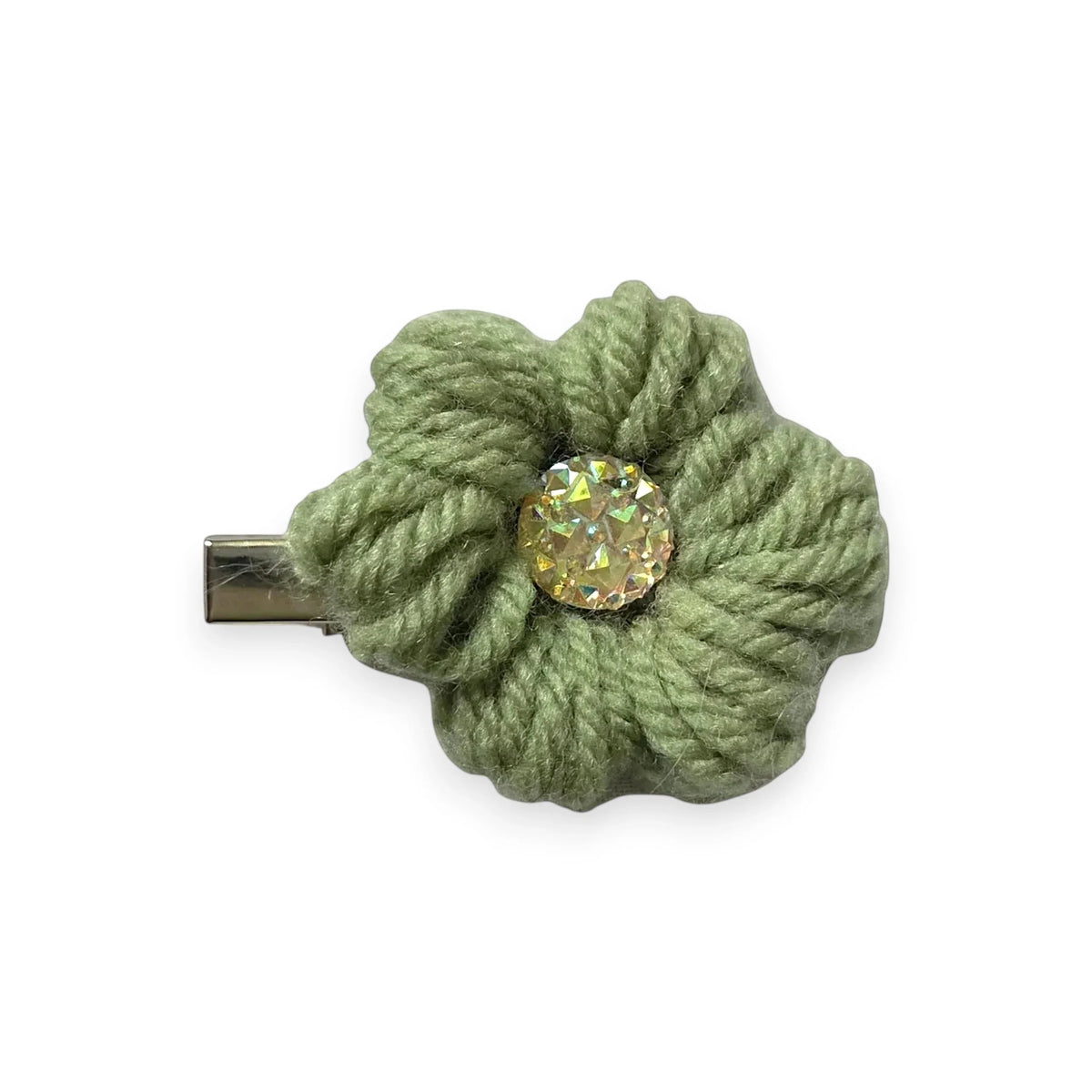 Handmade sage green crochet flower hair clip with sparkling gem center, cozy and creative accessory