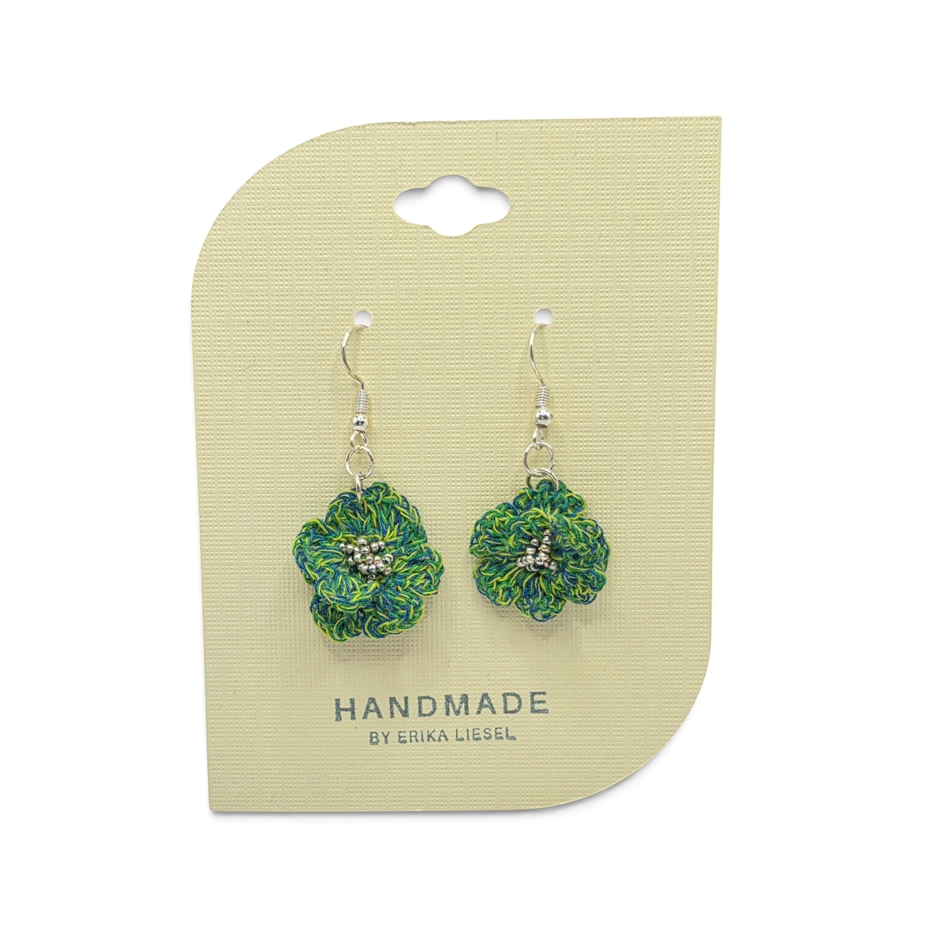 Handmade by Erika Liesel Bloom crochet flower earrings in green and blue thread with silver bead accents