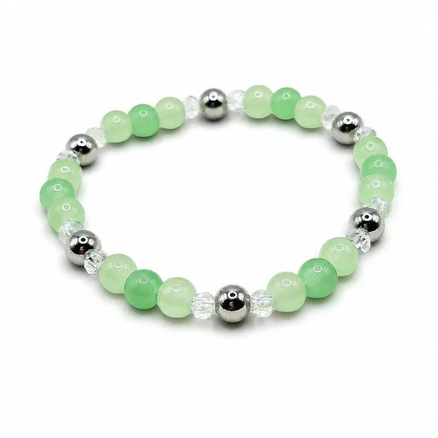 Handmade by Erika Liesel Meadow stretch bracelet featuring green glass beads, clear crystals, and silver-tone accents.