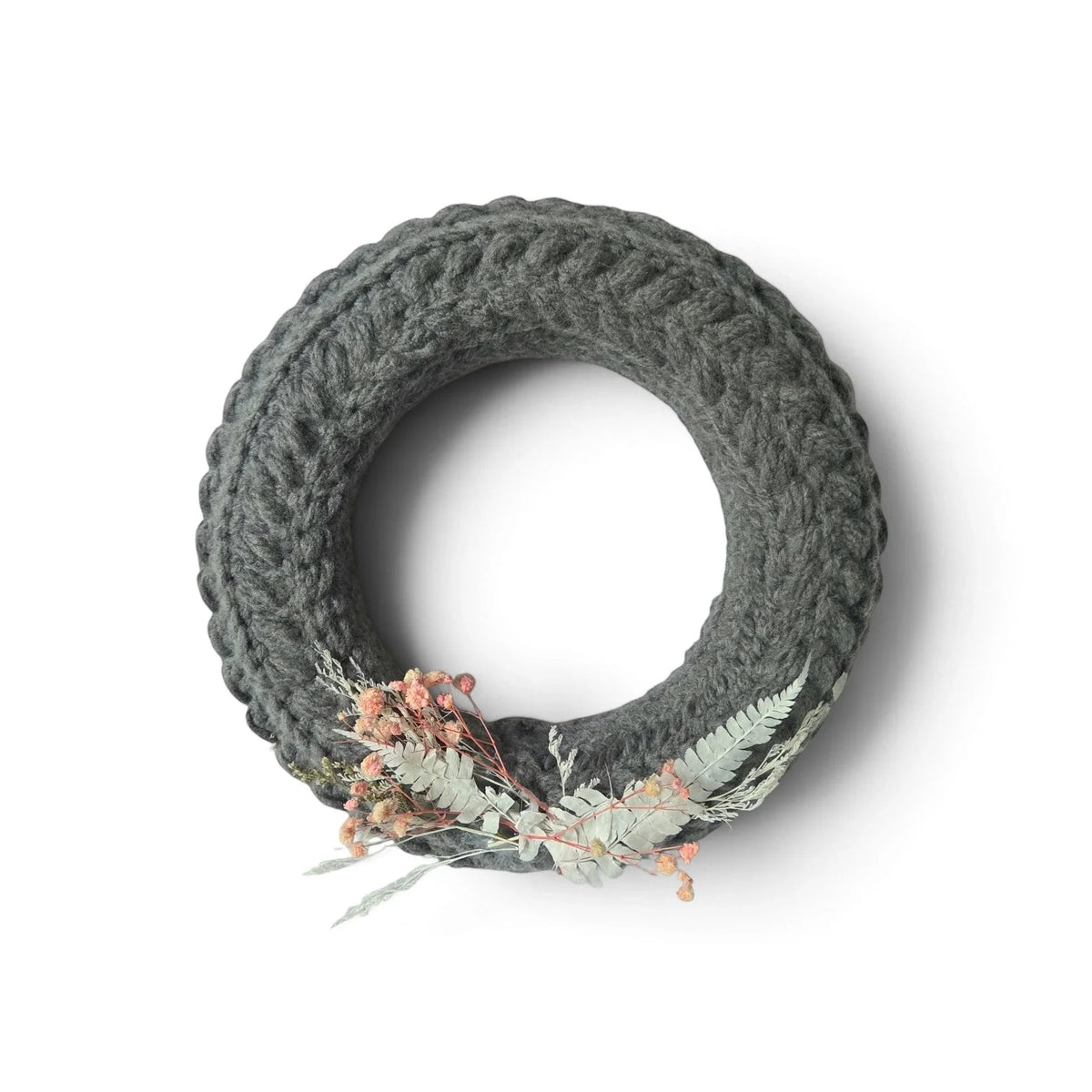 Handmade by Erika Liesel grey crochet wreath featuring delicate dried floral accents for year-round home decor.
