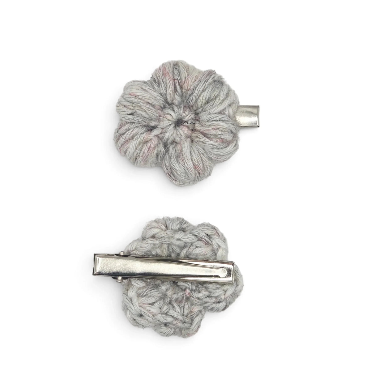 Handmade by Erika Liesel grey crochet flower barrettes with sturdy metal alligator clips for secure hair styling.