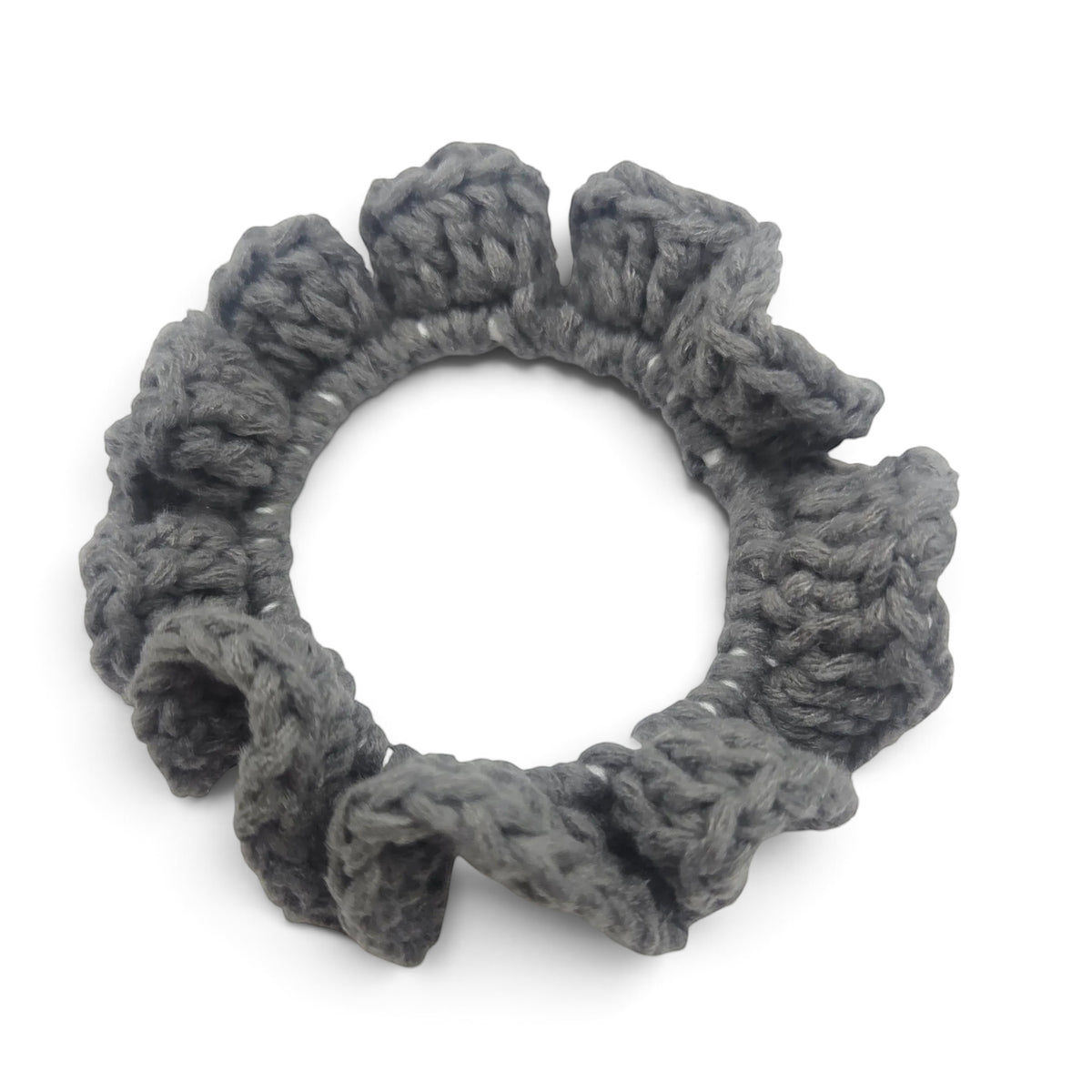 Handmade by Erika Liesel grey crochet scrunchie made from soft premium yarn for a gentle and polished hair hold.