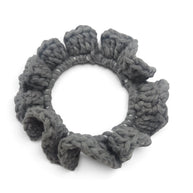 Handmade by Erika Liesel grey crochet scrunchie made from soft premium yarn for a gentle and polished hair hold.