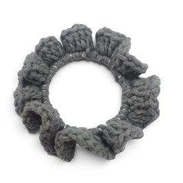 Handmade by Erika Liesel grey crochet scrunchie made from soft premium yarn for a gentle and polished hair hold.