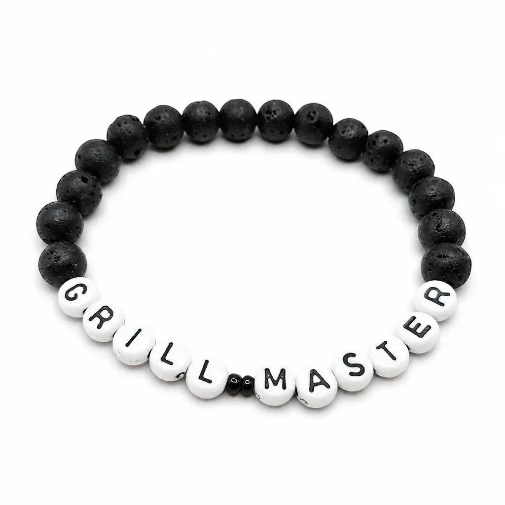 Handmade by Erika Liesel Grill Master bracelet with matte black 8mm lava stone beads and white letter beads.