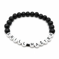 Handmade by Erika Liesel Grill Master bracelet with matte black 8mm lava stone beads and white letter beads.