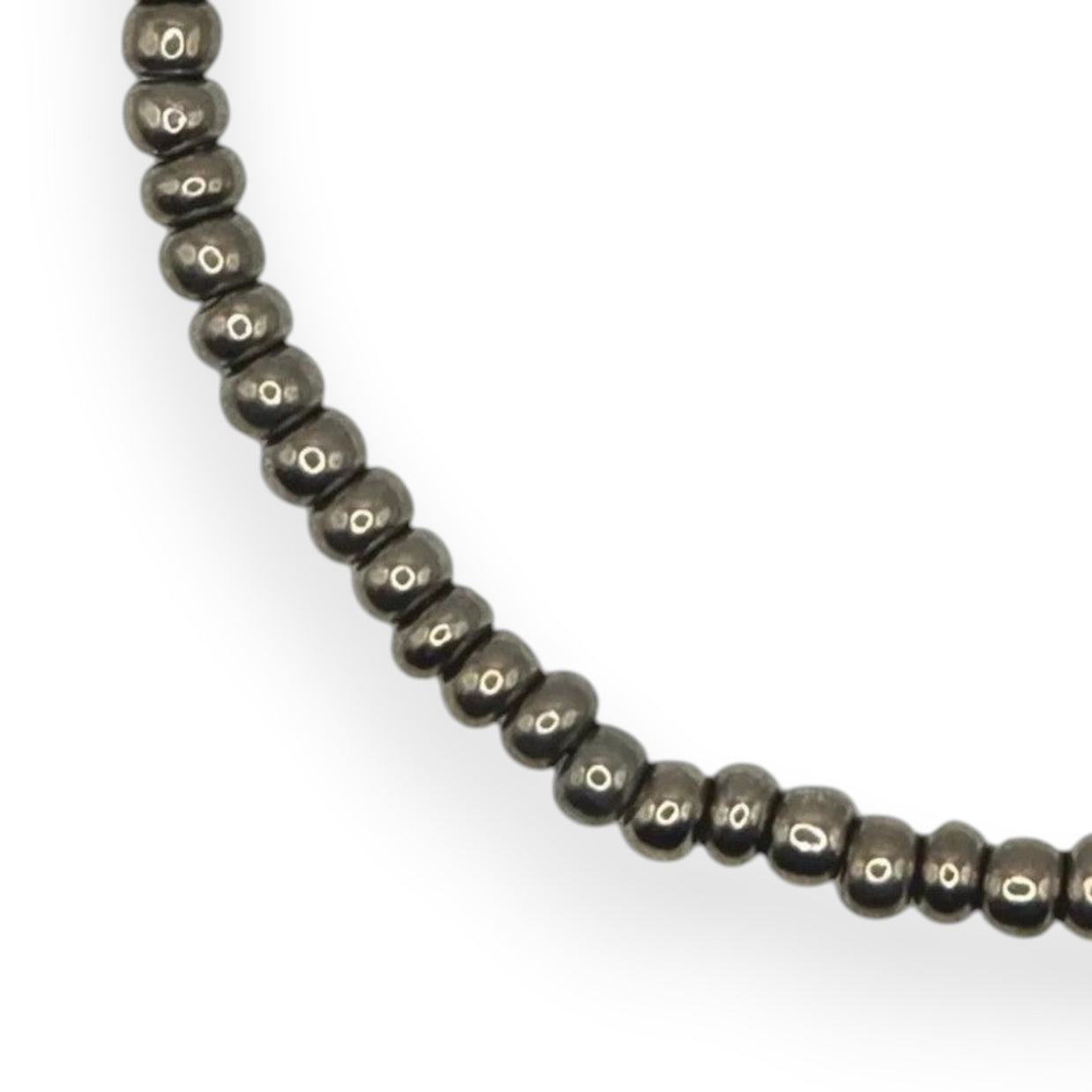 Handmade by Erika Liesel gunmetal gray glass bead stretch bracelet with a durable elastic cord design.