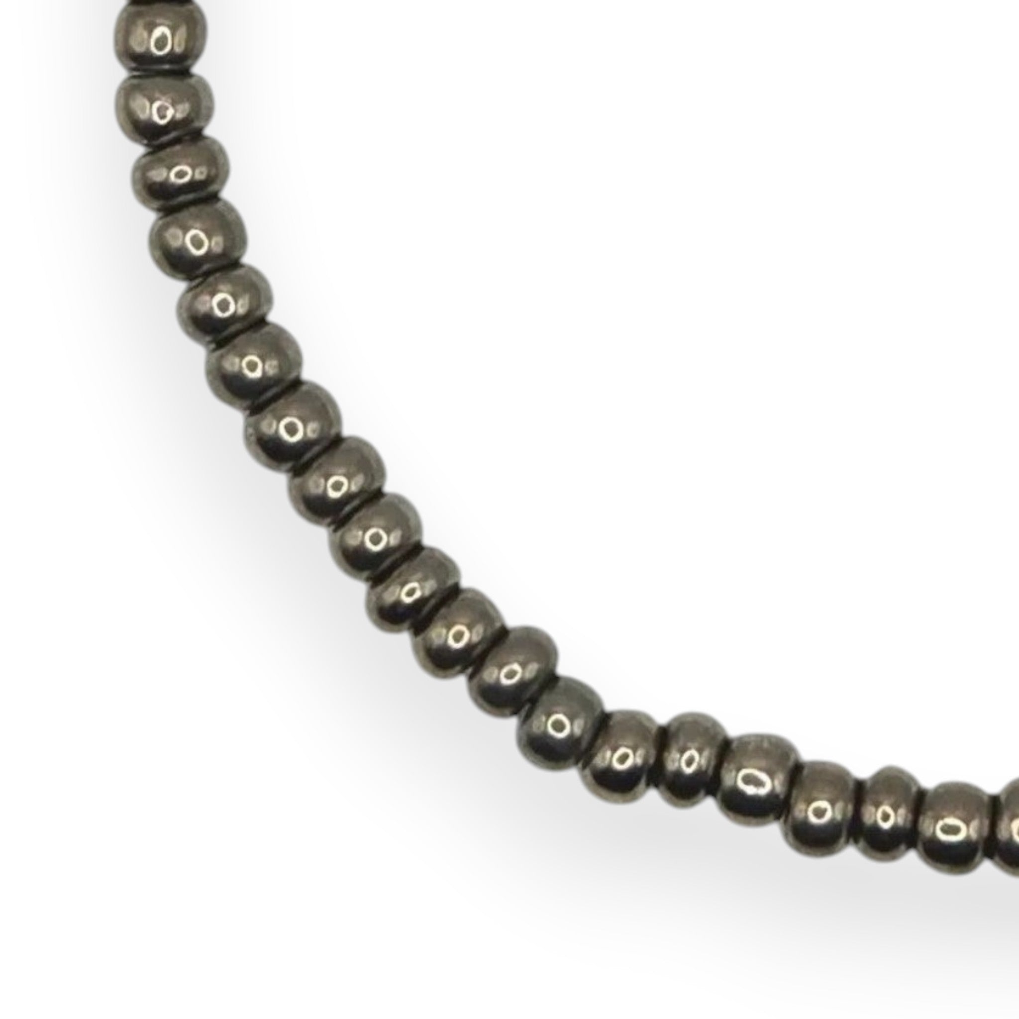 Handmade by Erika Liesel gunmetal gray glass bead stretch bracelet with a durable elastic cord design.