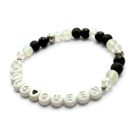 Handmade by Erika Liesel HalloQueen stretch bracelet with black, frosted, and crystal beads and silver letter accents.