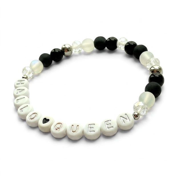 Handmade by Erika Liesel HalloQueen stretch bracelet with black, frosted, and crystal beads and silver letter accents.