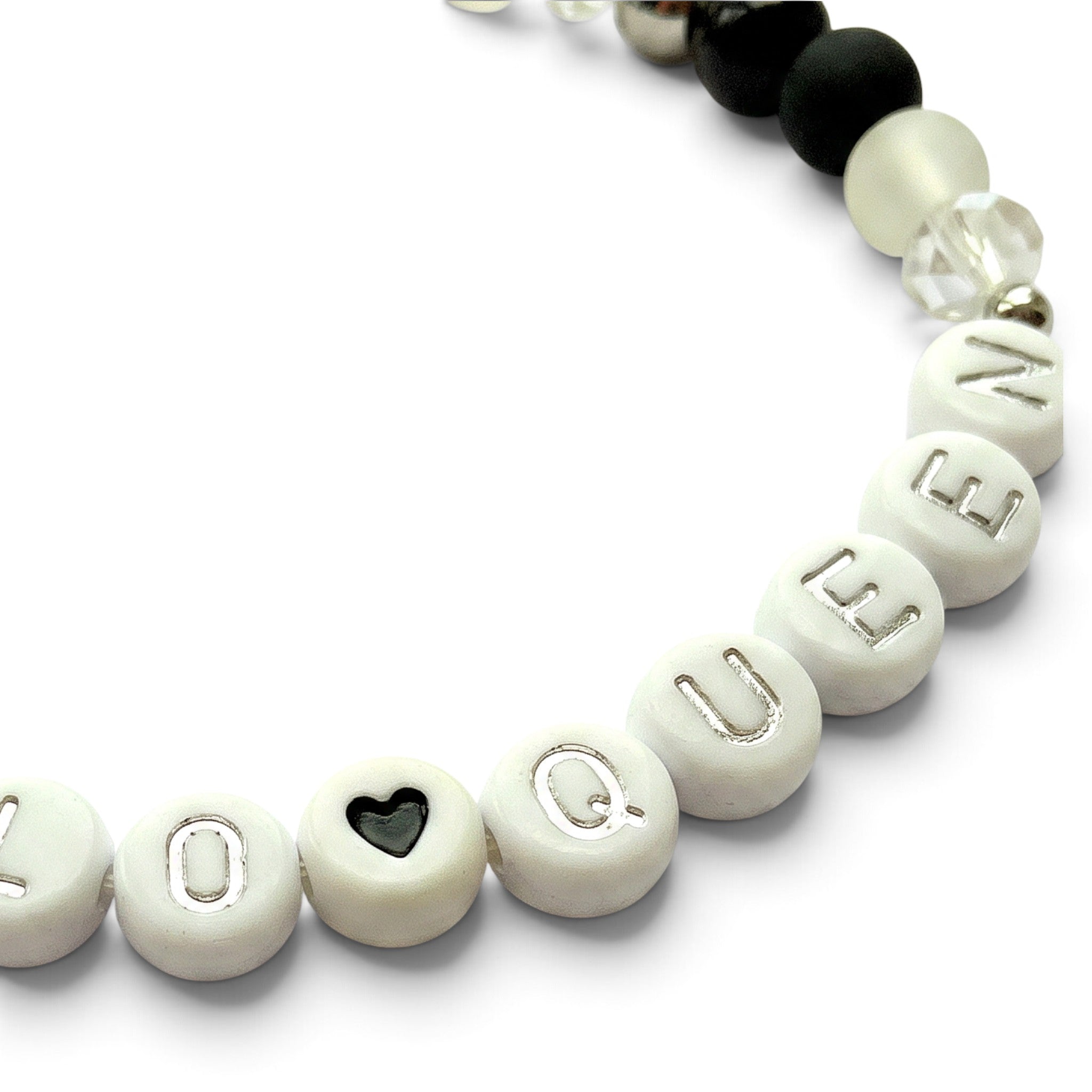 Handmade by Erika Liesel HalloQueen stretch bracelet with white letter beads, black heart, and glass crystal accents.