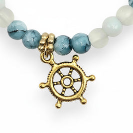 Handmade by Erika Liesel Harbor Bracelet with white and blue marbled glass beads and a gold-tone ship wheel charm.
