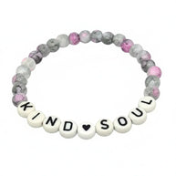 Handmade by Erika Liesel Kind Soul stretch bracelet with pink, gray, and white marbled glass beads on white background