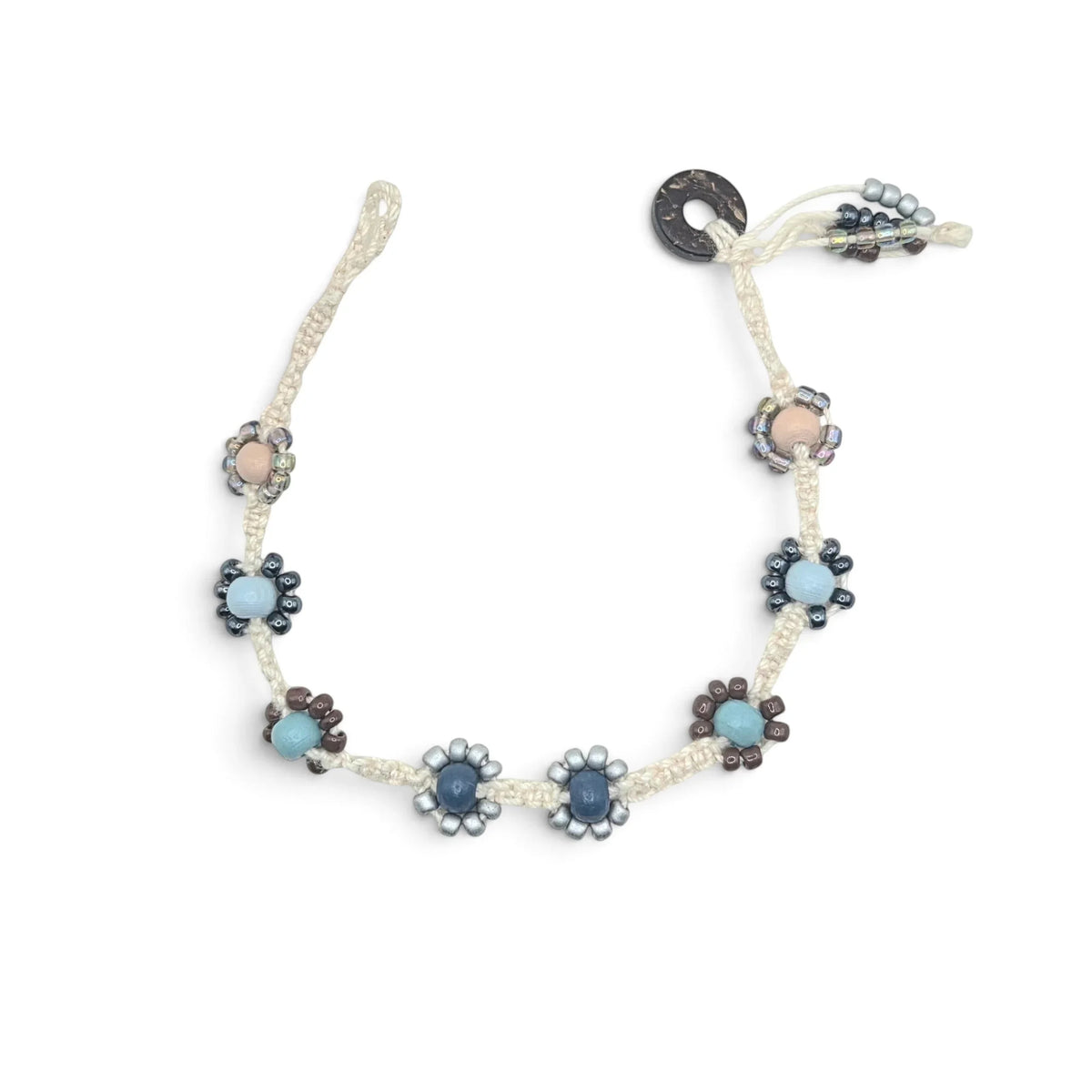 Handmade crochet necklace with blue and beige flower beads, macrame cord, and wooden toggle clasp