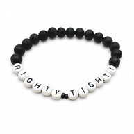 Handmade by Erika Liesel Righty Tighty men's bracelet with matte black lava stone beads and white letter beads.