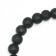 Handmade by Erika Liesel men's 8-inch stretch bracelet featuring matte black lava stone beads and Righty Tighty text.