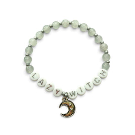 Handmade by Erika Liesel Lazy Witch stretch bracelet with gray glass beads, silver letters, and crescent moon charm.