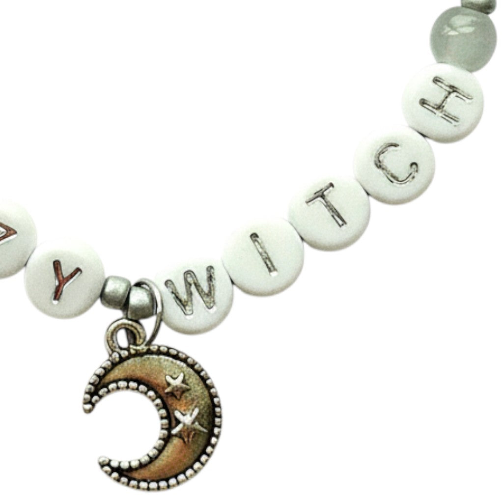 Handmade by Erika Liesel Lazy Witch bracelet with gray glass beads, silver letter beads, and a crescent moon charm.
