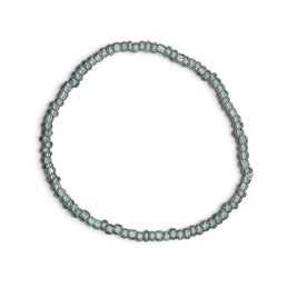 Handmade by Erika Liesel light blue translucent glass bead stretch bracelet on a white background