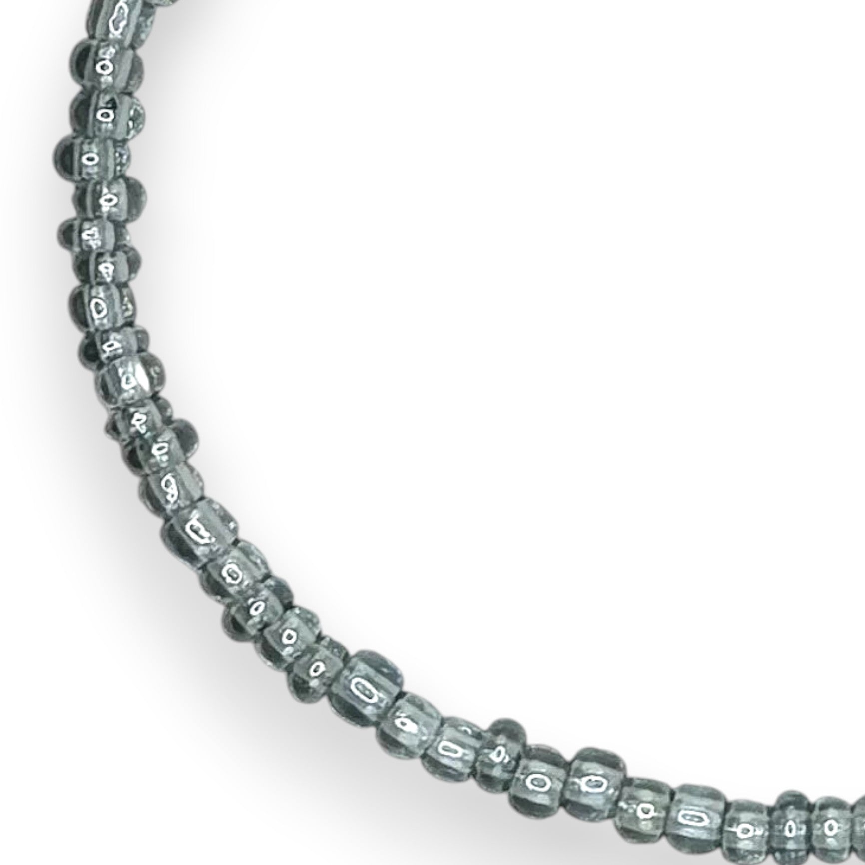 Handmade by Erika Liesel stretch bracelet featuring translucent light blue 3mm glass beads on a durable elastic cord.