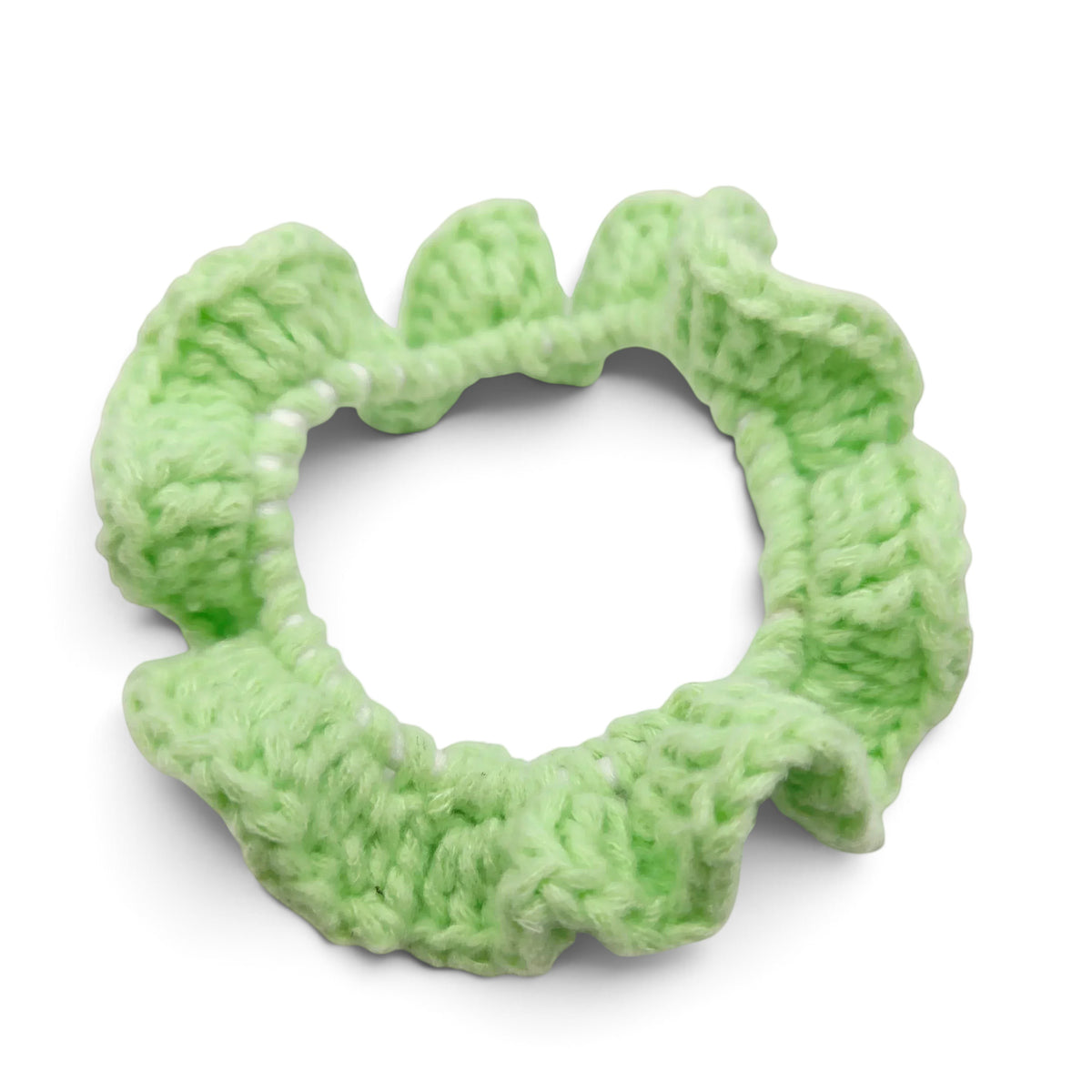 Handmade by Erika Liesel light green crochet scrunchie with a soft, textured yarn finish for a polished hairstyle.