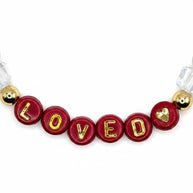 Handmade by Erika Liesel Loved bracelet featuring red letter beads with gold text and 18K gold-plated accents.
