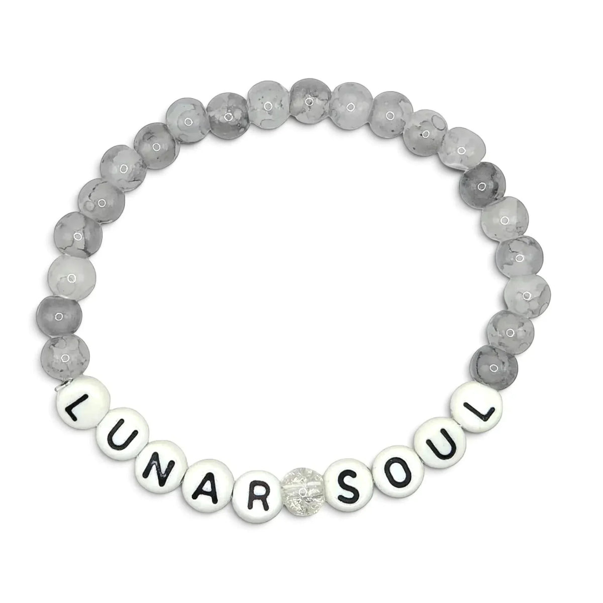 Handmade by Erika Liesel Lunar Soul stretch bracelet featuring gray marbled glass beads and white letter beads.