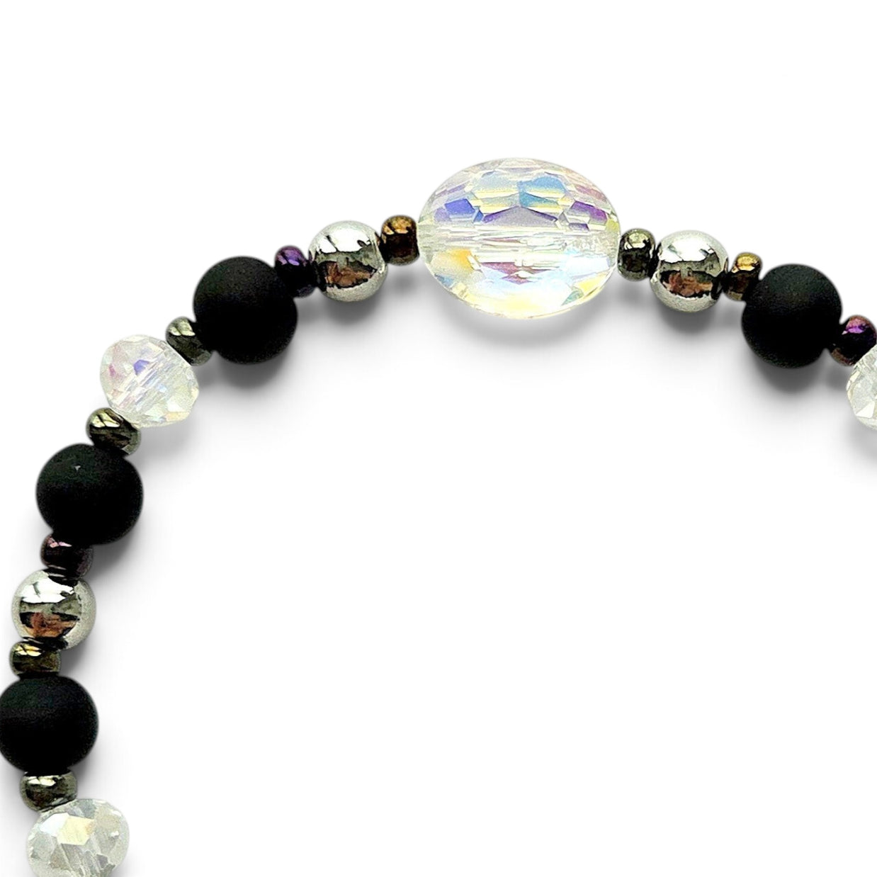 Handmade by Erika Liesel Magic stretch bracelet with matte black beads, silver accents, and iridescent crystal center.