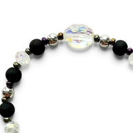 Handmade by Erika Liesel Magic stretch bracelet with matte black beads, silver accents, and iridescent crystal center.