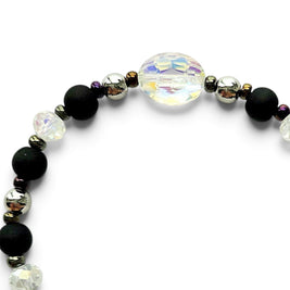 Handmade by Erika Liesel Magic stretch bracelet with matte black beads, silver accents, and iridescent crystal center.