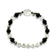 Handmade by Erika Liesel Magic stretch bracelet with matte black beads, silver accents, and iridescent crystal center.