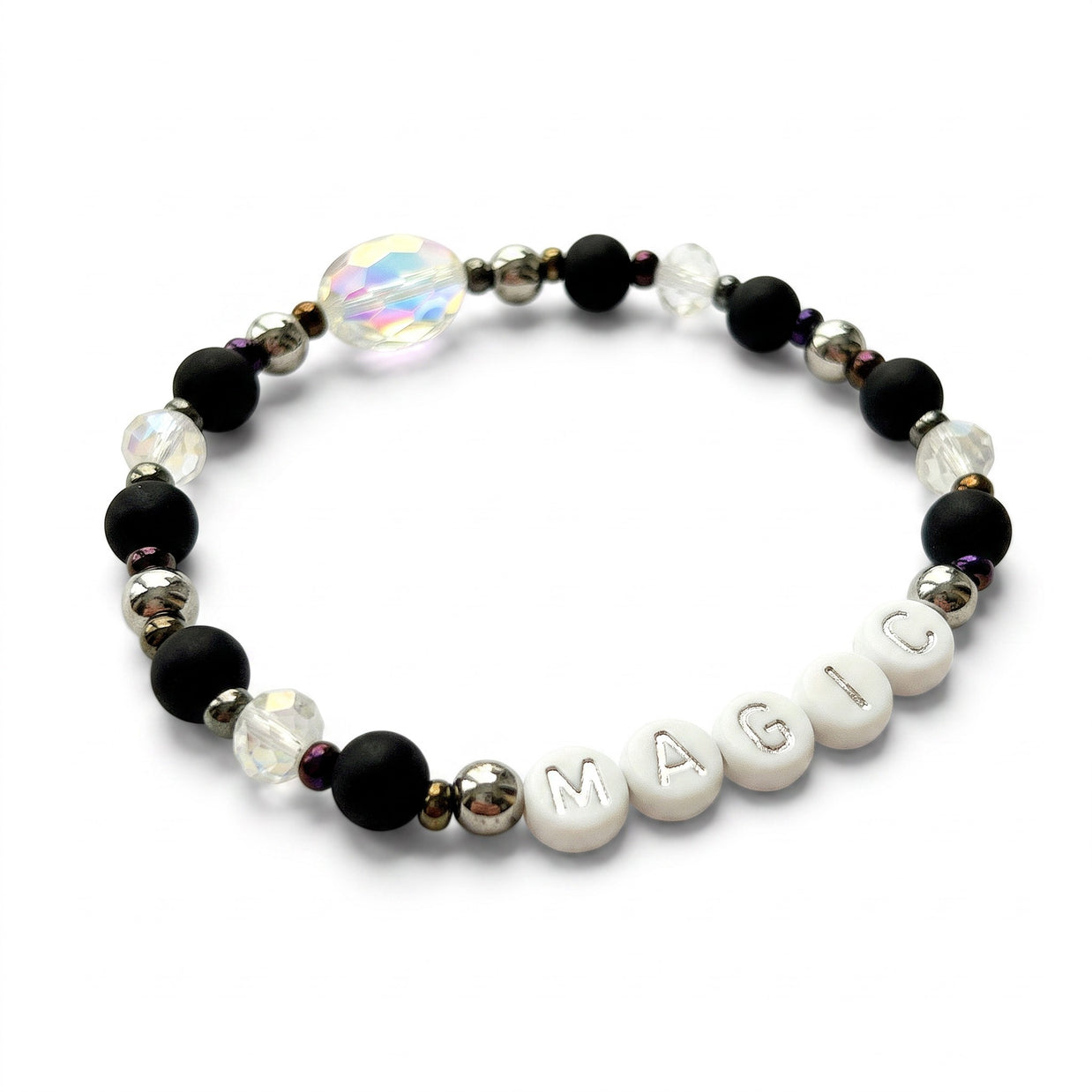 Handmade by Erika Liesel Magic stretch bracelet with matte black beads, silver letters, and iridescent crystals.