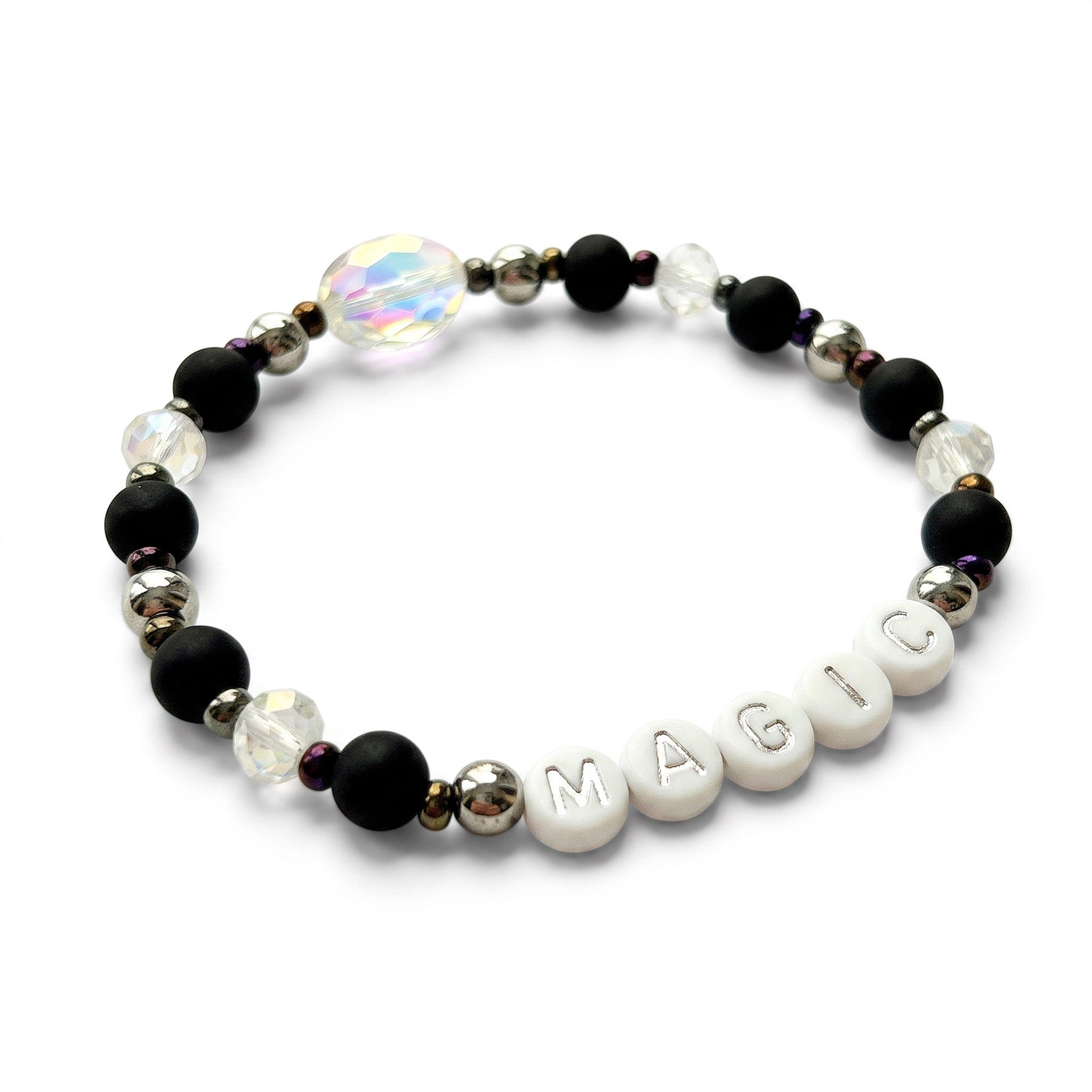 Handmade by Erika Liesel Magic stretch bracelet with matte black beads, silver letters, and iridescent crystals.