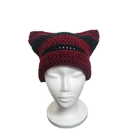 Handmade by Erika Liesel striped maroon and black crochet cat-ear beanie on a white mannequin head