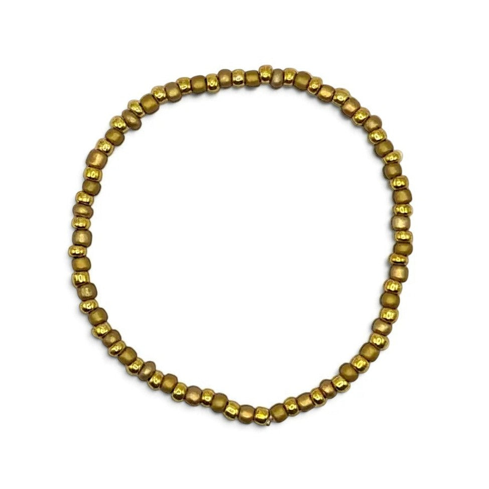 Handmade by Erika Liesel stretch bracelet featuring 3mm matte gold glass beads on a durable elastic cord.
