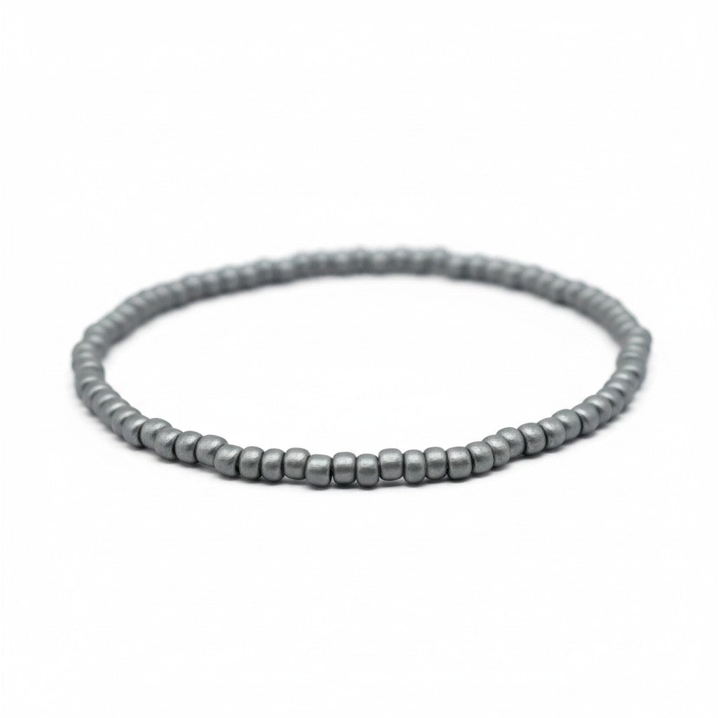 Handmade by Erika Liesel Frost bracelet featuring 3mm matte silver glass beads on a durable stretch elastic cord.