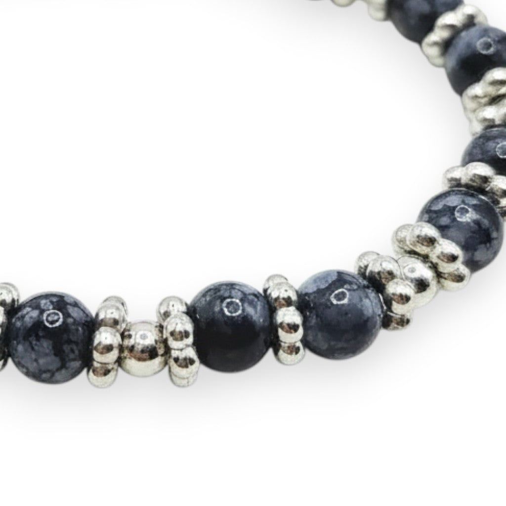 Handmade by Erika Liesel Midnight Marble stretch bracelet with black marbled glass beads and silver spacer accents.