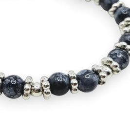 Handmade by Erika Liesel Midnight Marble stretch bracelet with black marbled glass beads and silver spacer accents.