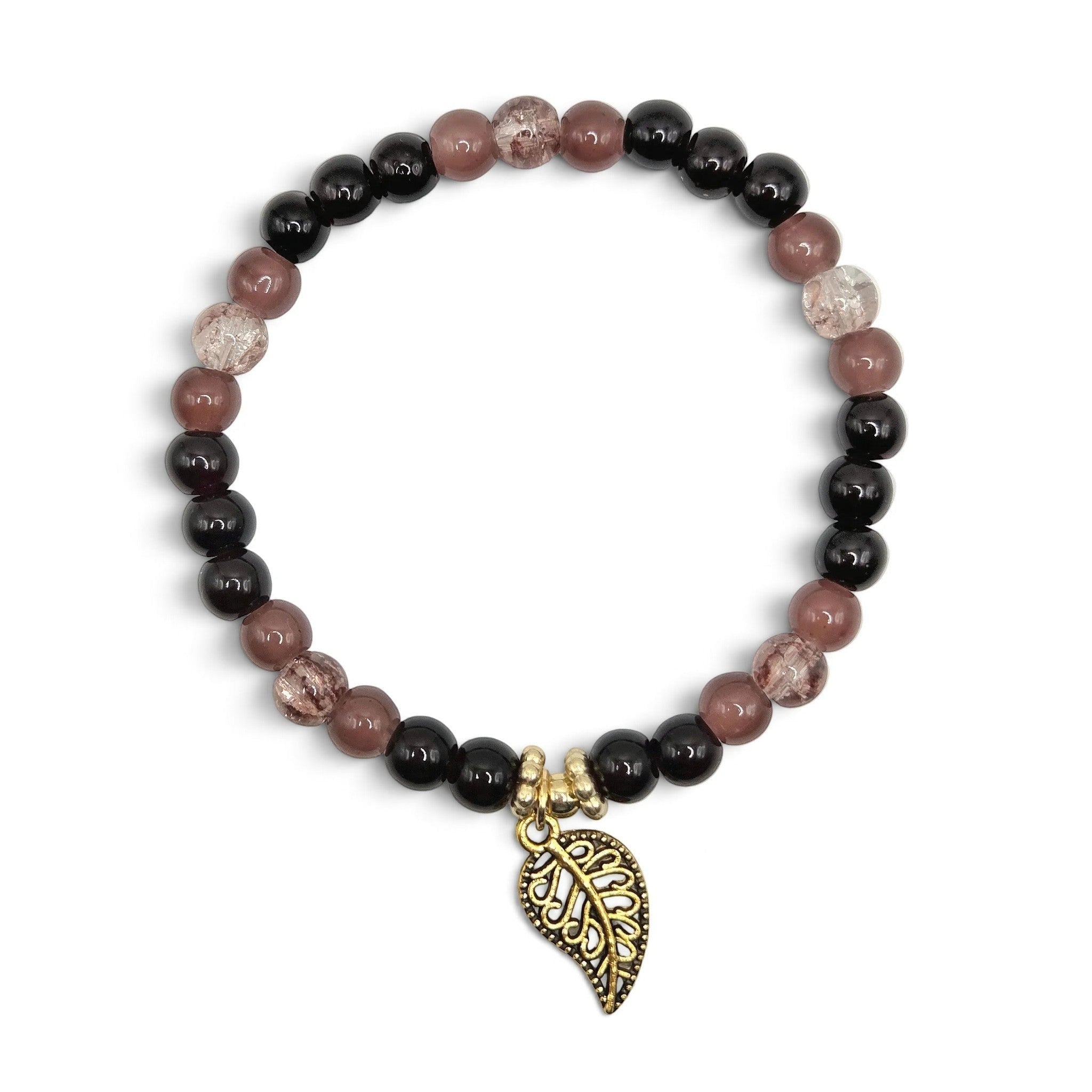 Handmade by Erika Liesel stretch bracelet with black, mulberry, and crackle glass beads and a gold-tone leaf charm.