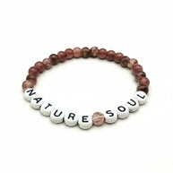 Handmade by Erika Liesel Nature Soul stretch bracelet with mauve and brown marbled glass beads on white letter beads.