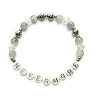 Handmade by Erika Liesel Nevermore stretch bracelet with gray marbled glass, crystal, and silver lettered beads.
