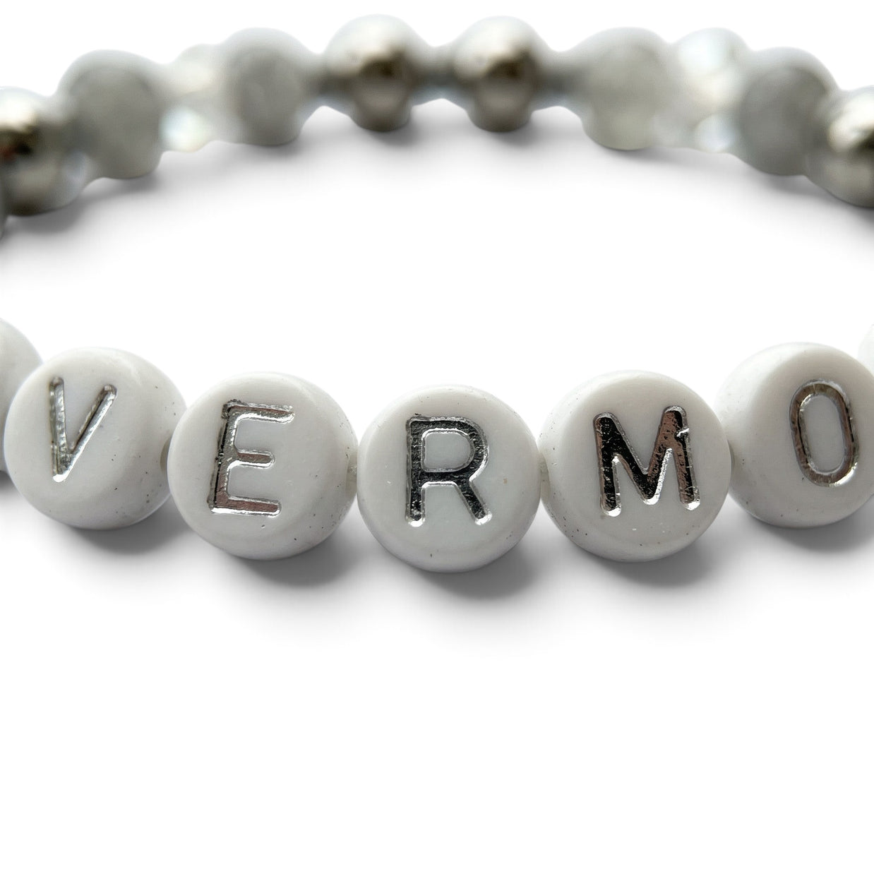 Handmade by Erika Liesel Nevermore stretch bracelet with white letter beads, gray marbled glass, and silver accents.