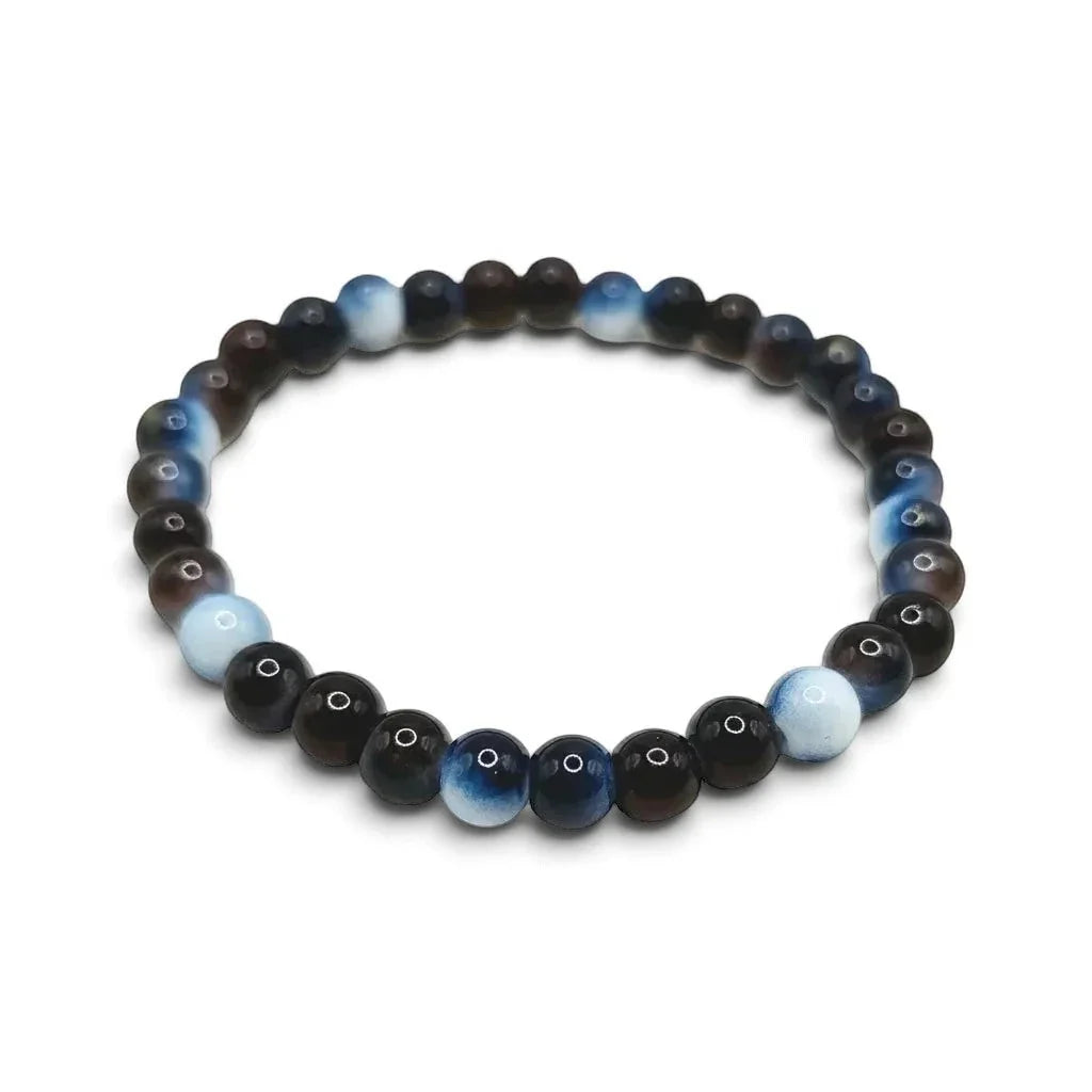 Handmade by Erika Liesel Nightfall stretch bracelet featuring 6mm polished dark blue and brown glass beads.