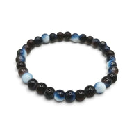 Handmade by Erika Liesel Nightfall stretch bracelet featuring 6mm polished dark blue and brown glass beads.
