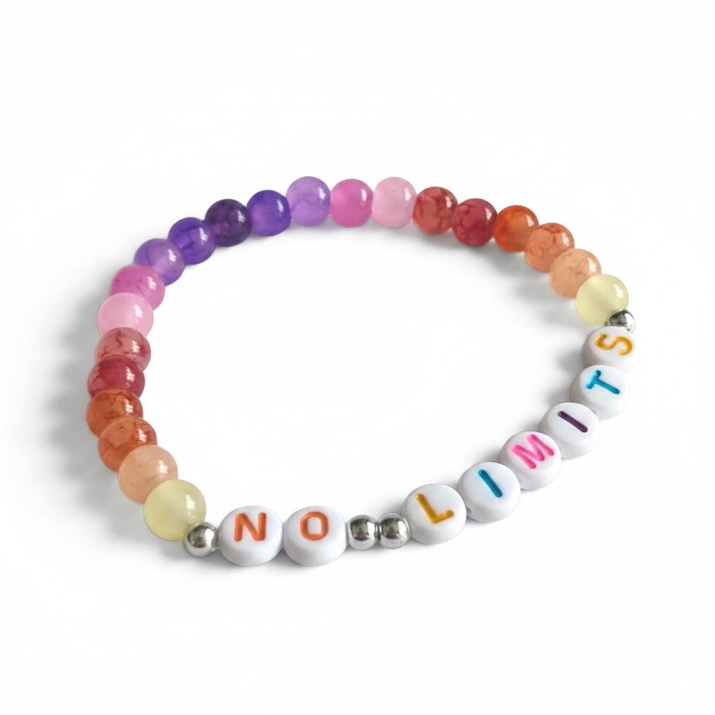 Handmade by Erika Liesel No Limits bracelet with colorful glass beads and white letter beads on elastic cord