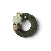 Handmade by Erika Liesel mini crochet wreath in olive green with dried white flowers and a burlap ribbon accent.