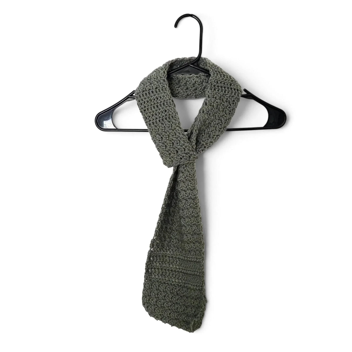 Handmade by Erika Liesel olive green crochet keyhole scarf hanging on a black hanger