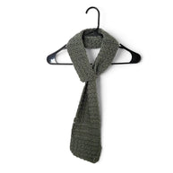 Handmade by Erika Liesel olive green crochet keyhole scarf hanging on a black hanger