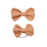 Handmade by Erika Liesel peach crochet bow hair tie set featuring two different sized textured yarn bows