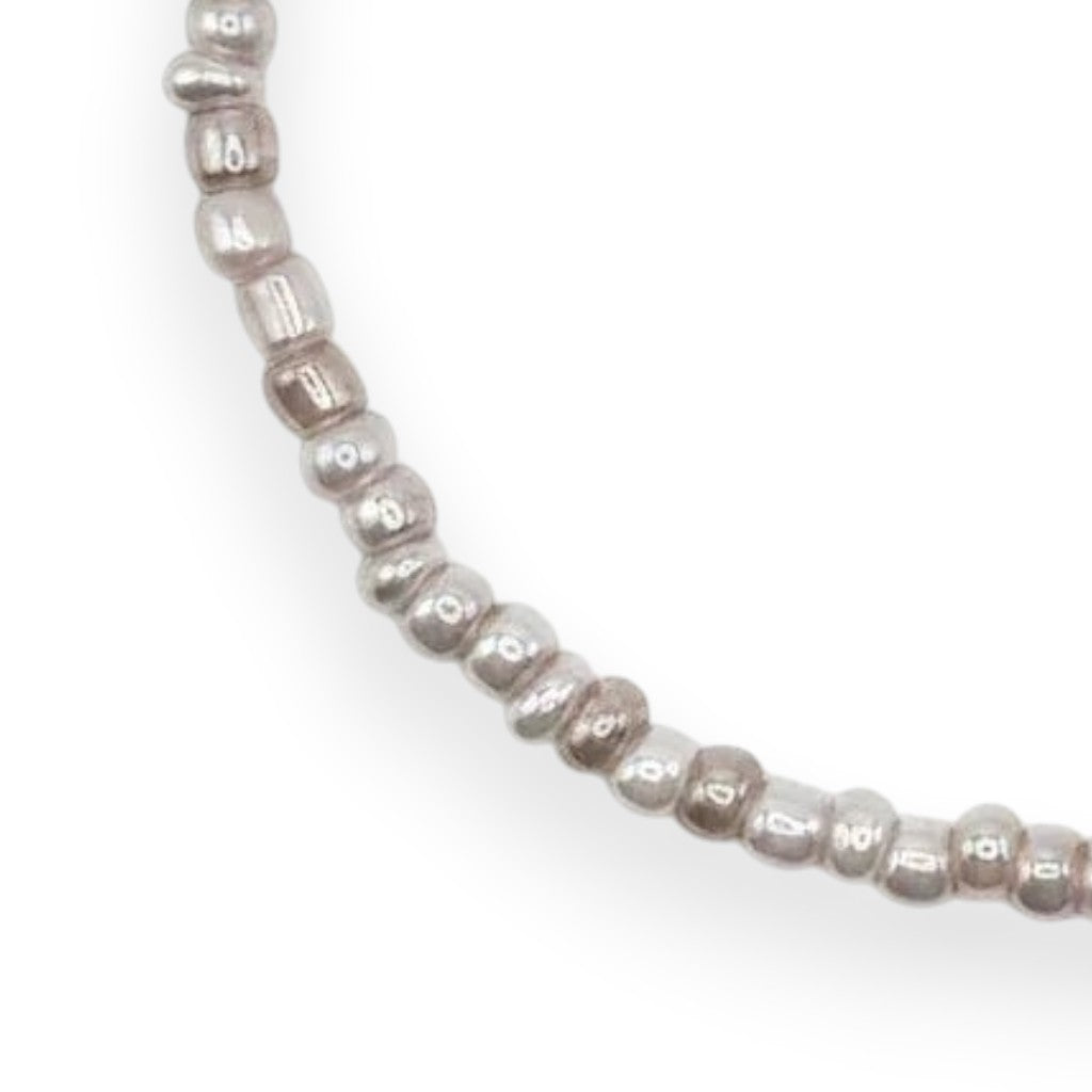 Handmade by Erika Liesel pearl gray glass bead stretch bracelet with a delicate luminous finish.